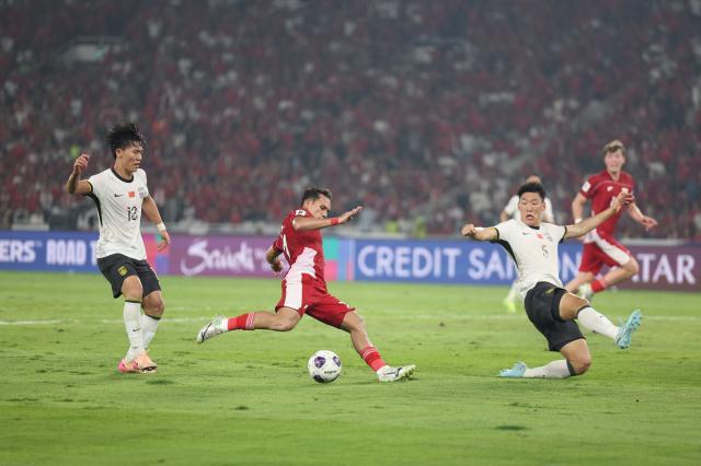 1749392055757064369.jpg (体育)(25)足球——世预赛:中国队对阵印度尼西亚队XxjpseC007366_20250605_PEPFN0A001.jpg